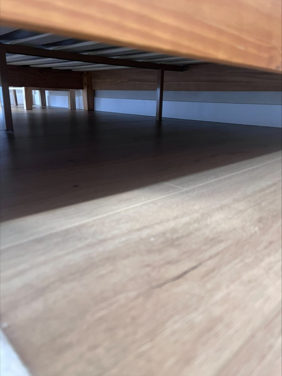 The same floor under the bed spotless after cleaning