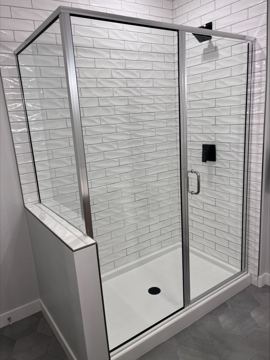 A freshly cleaned tiled shower enclosure with streak-free glass